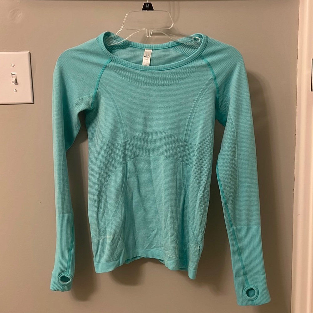 Blue long sleeve activewear shirt.